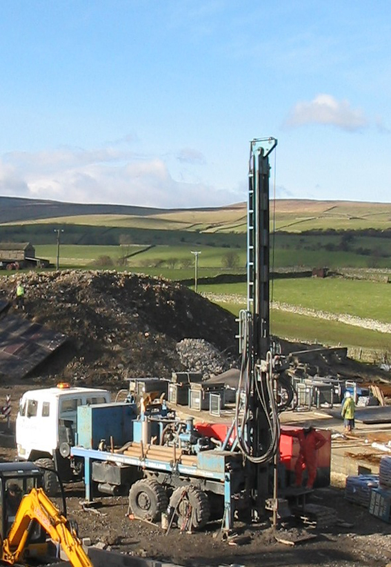 Commercial geothermal system installation commences with drilling of multiple closed loop boreholes in a borefield array, north Pennines