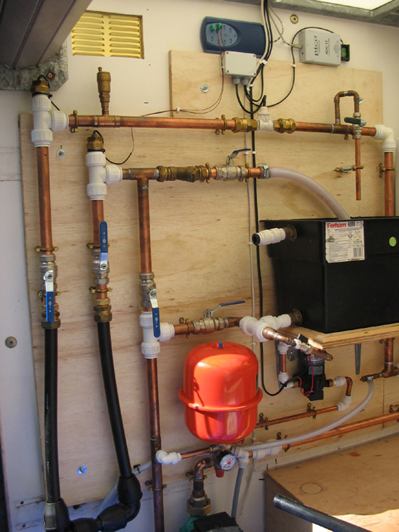Part of the internal equipment in the Thermal Conductivity Test Rig operated by GeoWarmth Ltd. The t rig injects heat energy into the test borehole and the thermal build-up and decay is logged over several days. Analysis of the data from a TCT borehole provides essential design information for specifying borefield grid spacing and depth that will deliver the required long term sustainable output.
